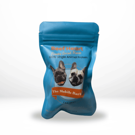 Small blue pouch labeled Beef Heart Freeze Dried Pieces with two illustrated dogs on the front.
