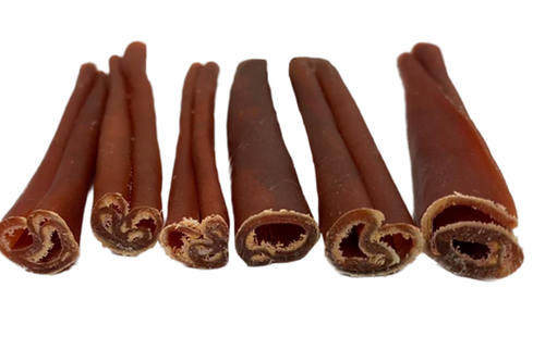 Six natural bully sticks for dogs in assorted thicknesses, arranged side by side with visible curled ends