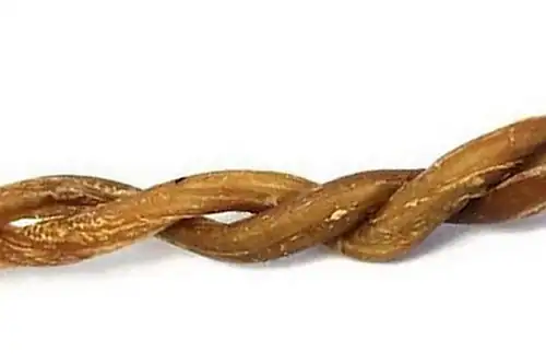 Braided lamb pizzle dog chew with natural brown texture on a white background