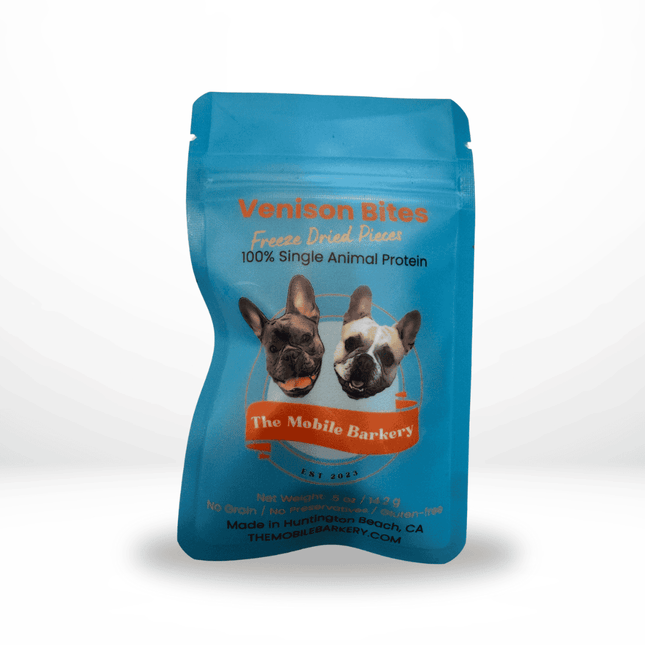 Blue pouch of freeze-dried venison dog treats labeled Venison Bites with cartoon bulldogs